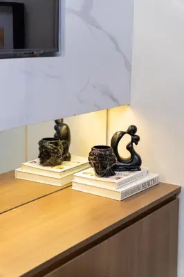 two books on a counter with a cup on top at Modern Condo at Park McKinley West with Wi-Fi and Washer in Manila