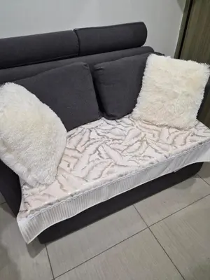 a bed with two pillows on top of it at Zen 2 Shore A Residences in Manila