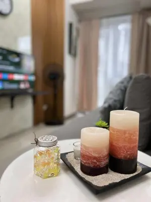 two candles on a tray on a table at Chic Urban Escape at S Residence Tower 3 in Manila