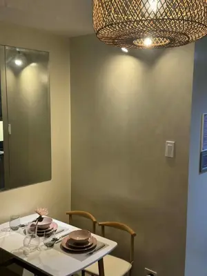 a table with plates on it with a mirror at Dusk Suites elevated escapes at Shell Residences, Mall of Asia Complex in Manila