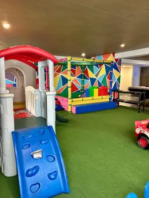 a childrens play room with a playground and a play equipment at Prime Makati Condo Near Poblacion & Malls in Manila