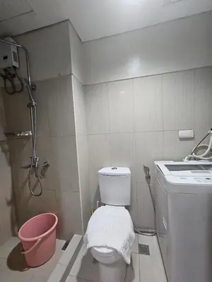 a small bathroom with a toilet and a sink at Shell MOA Facing View 1BR near Ikea, NAIA, PICC Shell003 in Manila