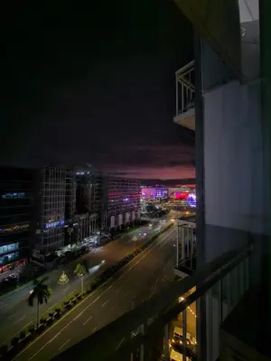 a view of a city street at night at Shell MOA Facing View 1BR near Ikea, NAIA, PICC Shell003 in Manila