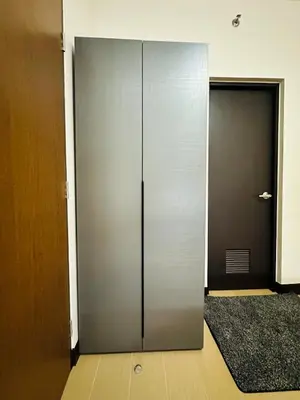 a large metal door in a room with a doorway at Minimalist 1BR Condo at Araneta City, Cubao in Manila