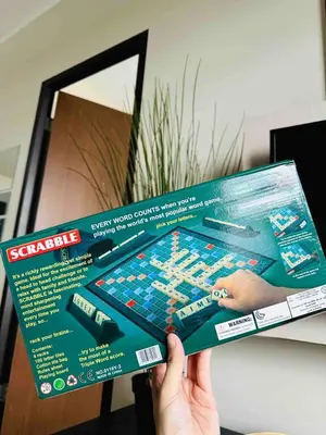 a person holding up a video game board at Minimalist 1BR Condo at Araneta City, Cubao in Manila