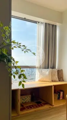 a window seat with a view of a city at 3 min to Rockwell City View Pool Parking in Manila
