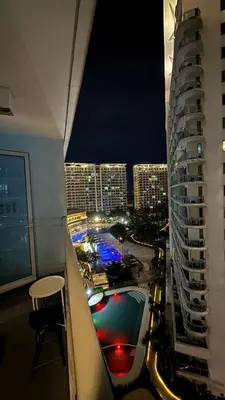 a view of a city at night from a building at Azure Urban Resort 1BR-2BR Boracay in Manila