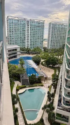 arial view of a pool in a resort with tall buildings at Azure Urban Resort 1BR-2BR Boracay in Manila