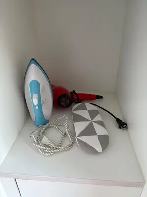 a box with a game console and other items at 1BR at One Uptown Residence BGC Across Uptown Mall in Manila