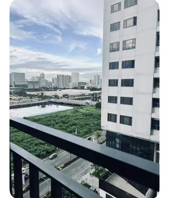 a view from the balcony of a building at Staycay at SRESIDENCES in Manila