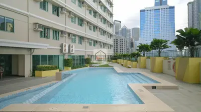 a large swimming pool on the side of a building at Aludia's Dreamplace in Manila