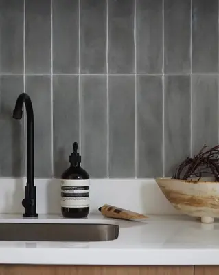 a sink with a bottle of soap on a counter at The Florentine Suite in Manila