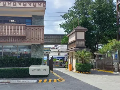 a building with a sign that says optopoulos on it at The Florentine Suite in Manila