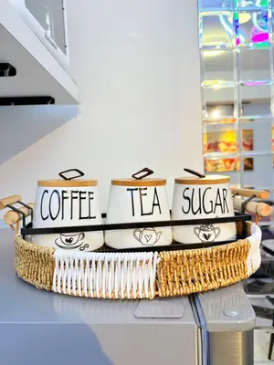 a stack of coffee tea sugar bowls on a counter at Ohana JPL Azure Staycation in Manila