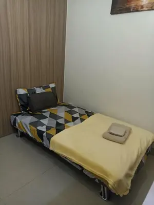 a bed in a room with a pillow on it at SM Mall of Asia Shore2 Tower2 Nano Nap&Go in Manila