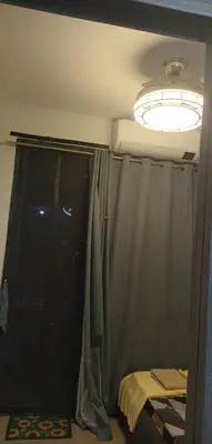 a room with a window with a curtain and a light at SM Mall of Asia Shore2 Tower2 Nano Nap&Go in Manila