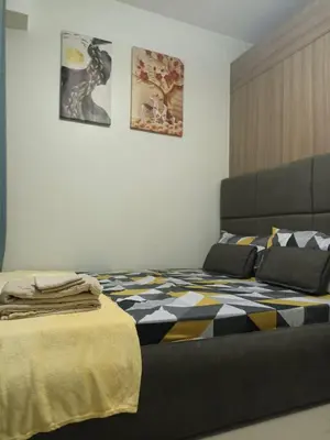 a bedroom with a bed with a blanket on it at SM Mall of Asia Shore2 Tower2 Nano Nap&Go in Manila