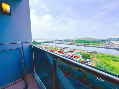 a balcony with a view of a river and a train at City Center Near Mall BIG 2 BEDROOM 2 RESTROOM City View Family-Friendly SHORE 2 RESIDENCE Tower 1 in Manila