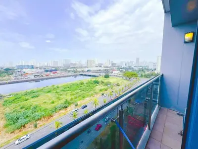 a balcony with a view of a river and a city at City Center Near Mall BIG 2 BEDROOM 2 RESTROOM City View Family-Friendly SHORE 2 RESIDENCE Tower 1 in Manila