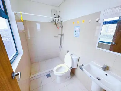 a bathroom with a toilet and a tub and a sink at City Center Near Mall BIG 2 BEDROOM 2 RESTROOM City View Family-Friendly SHORE 2 RESIDENCE Tower 1 in Manila