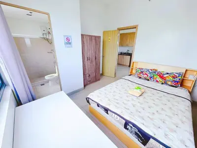 a small bedroom with a bed and a bathroom at City Center Near Mall BIG 2 BEDROOM 2 RESTROOM City View Family-Friendly SHORE 2 RESIDENCE Tower 1 in Manila