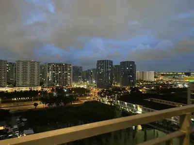 a view of a city at night with buildings at Shore 2 Residence Erlinda suite in Manila