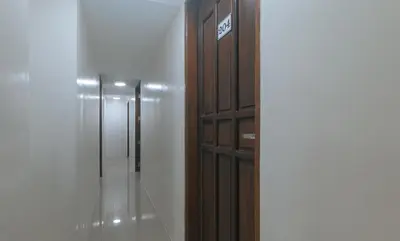 a hallway with a row of elevators in a building at RedDoorz at FCCG GoldMoon Boutique Hotel in Manila