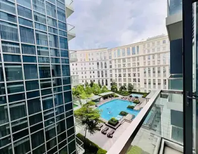 a view from the balcony of a building with a pool at Eighty One Newport Blvd Condo near NAIA3 in Manila