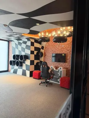 a office with a chair and a checkered wall at Deluxe Room with Pool View Unit in Poblacion in Manila