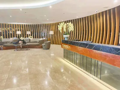 a lobby of a hotel with a couch and a table at Ameera Condo Stay in Manila