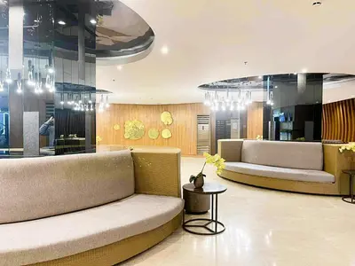 a living room with two couches and a table at Ameera Condo Stay in Manila