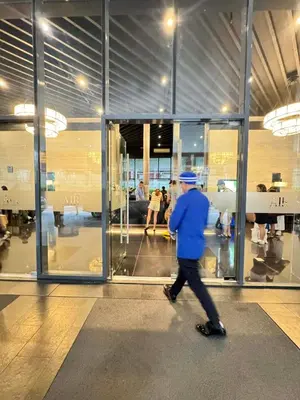 a man walking in front of a building at Budget-Friendly Condo in Makati in Manila
