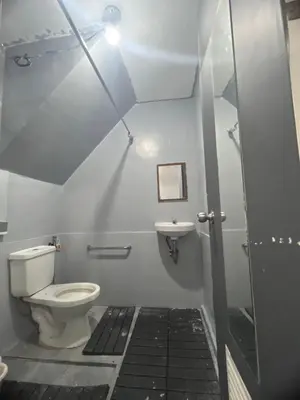 a bathroom with a toilet and a sink at Alilonch Transient