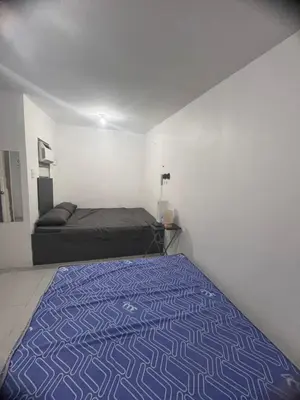 a bedroom with a bed in a room at Alilonch Transient