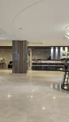 an empty lobby with a luggage claim area in a building at The Turianos in Manila
