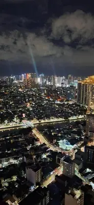 a view of a city at night with at STAYLUXIA BOUTIQUE HOTEL KNIGHTSBRIDGE Pool Netflix Free Amenities in Manila