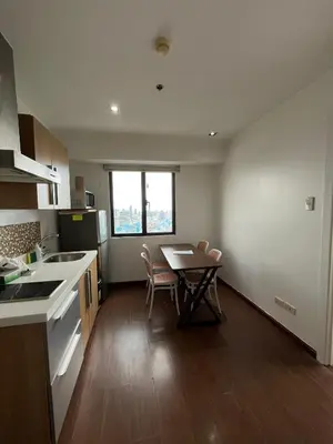 a small kitchen with a table and chairs in it at STAYLUXIA BOUTIQUE HOTEL KNIGHTSBRIDGE Pool Netflix Free Amenities in Manila