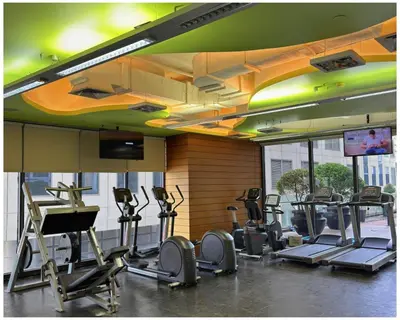 a gym with treadmills and exercise equipment in a room at STAYLUXIA BOUTIQUE HOTEL KNIGHTSBRIDGE Pool Netflix Free Amenities in Manila