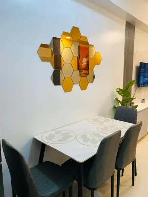 a dining room with a table and chairs at Shore 3 Residences in Manila