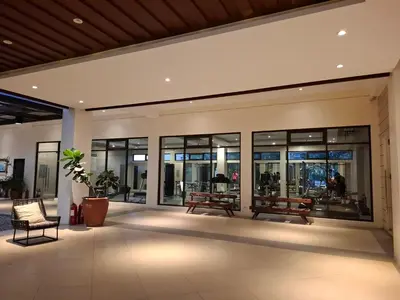 a lobby of a building with benches and windows at Cozy Hotel-Style Studio Unit for Rent at Eastbay Residences by Rockwell in Manila