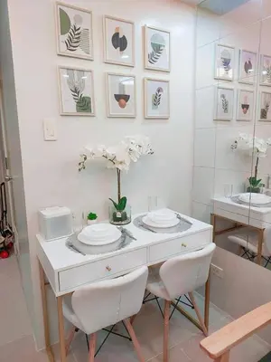 a dining room with a table and two chairs at Sea Residences in Manila