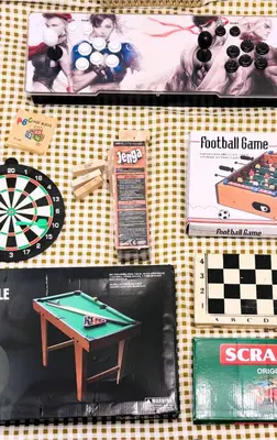 a table with a dart board and a game at 1BR 4Pax Condo Azure Beach Resort Pool View Fully Furnished with PS4 in Manila