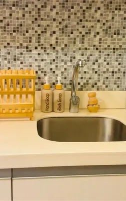 a kitchen counter with a sink and two soap bottles at 1BR 4Pax Condo Azure Beach Resort Pool View Fully Furnished with PS4 in Manila
