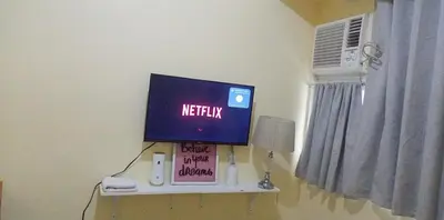 a computer monitor on a shelf in a room at Urban Deca Tower at Mandaluyong in Manila