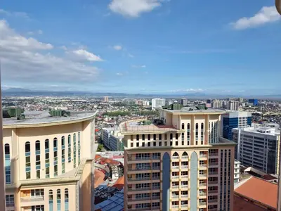 an aerial view of a city with tall buildings at Luxe Spacious Cozy Venice BGC 65inTV Surround Sound in Manila