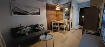 a small living room with a couch and a table at Avida Sucat Paranaque City in Manila