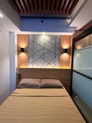 a bedroom with a bed in a room at Bayshore Getaway Condotel ByClowie in Manila