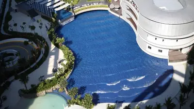an overhead view of a pool of water next to a building at Dream Catchers Azure Staycation in Manila