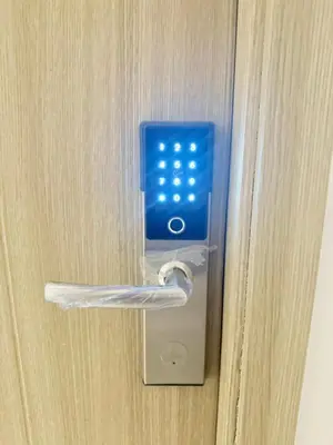 a door opener with a key in a door at Luxe Condo at MOA in Manila