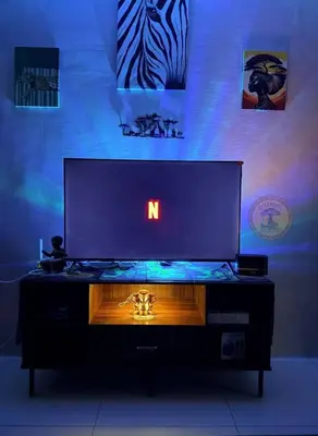 a large television screen with the letter n on it at Cozy African Home in Parañaque in Manila